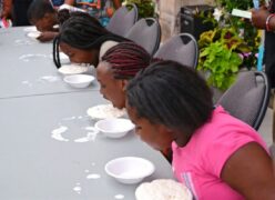 Four kids having an eating contest