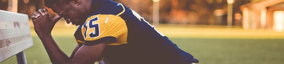 Praying on a park bench